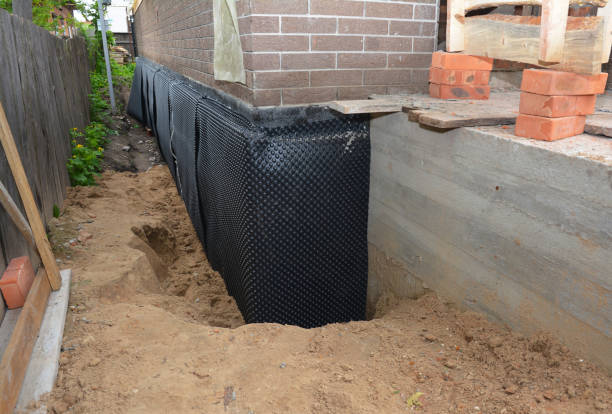 Happy homeowners after waterproofing job in Coalfield